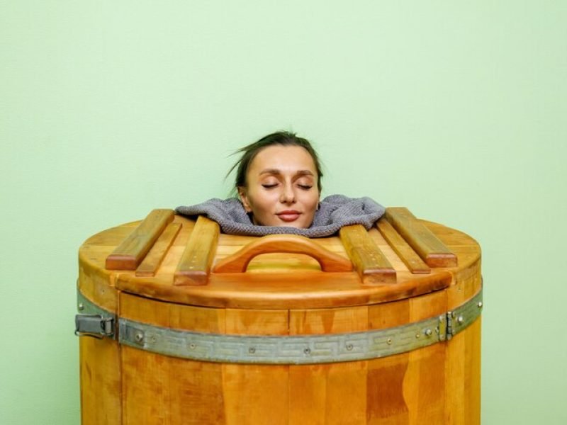 woman-cedar-spa-barrel-body-rejuvenation-relax-sauna_164075-1693